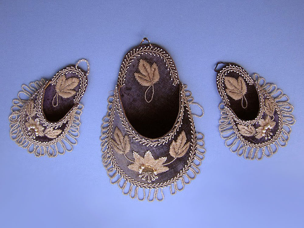 Two non-Native matching Victorian watch holders and a matching wall pocket