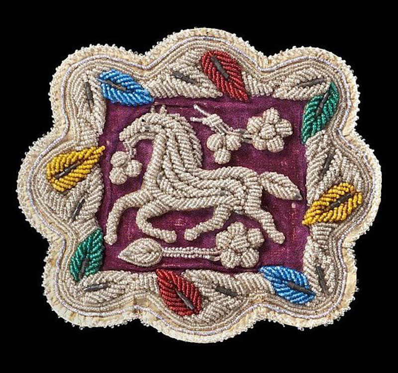 A beaded mat with horse image