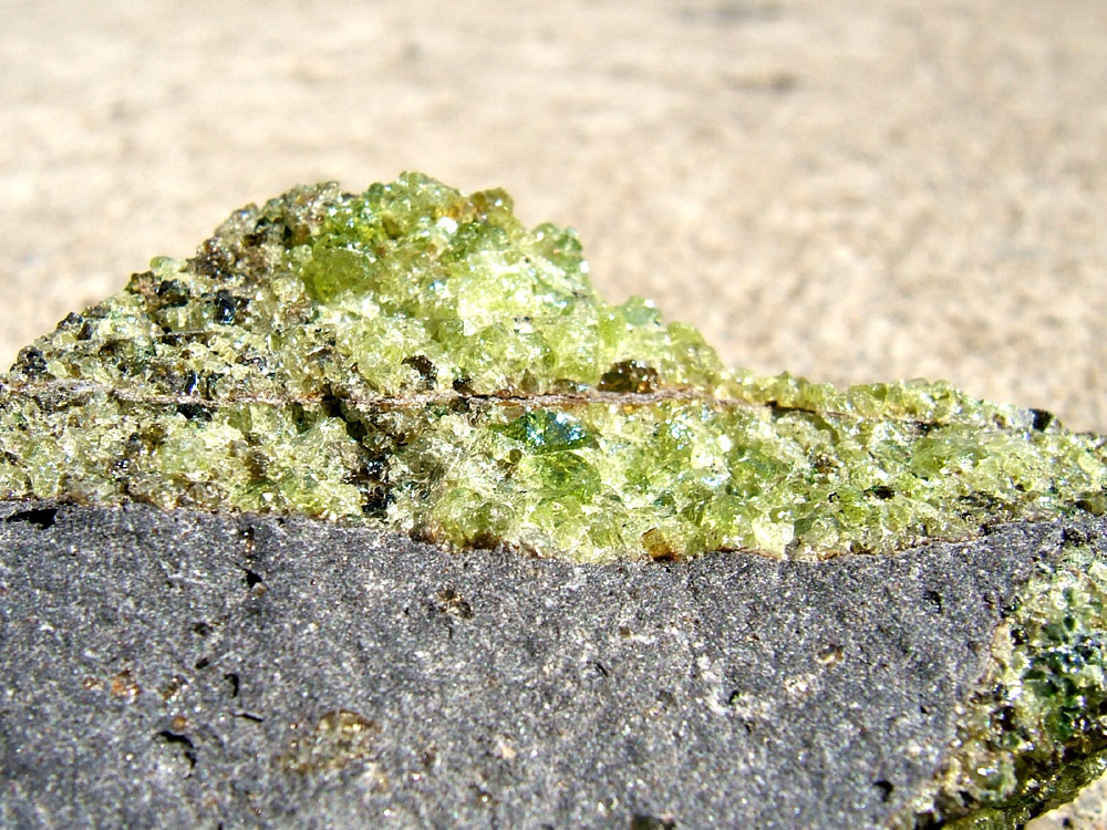 Peridot with minor pyroxene on vesicular basalt