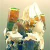 Tri-color elbaite crystals on quartz