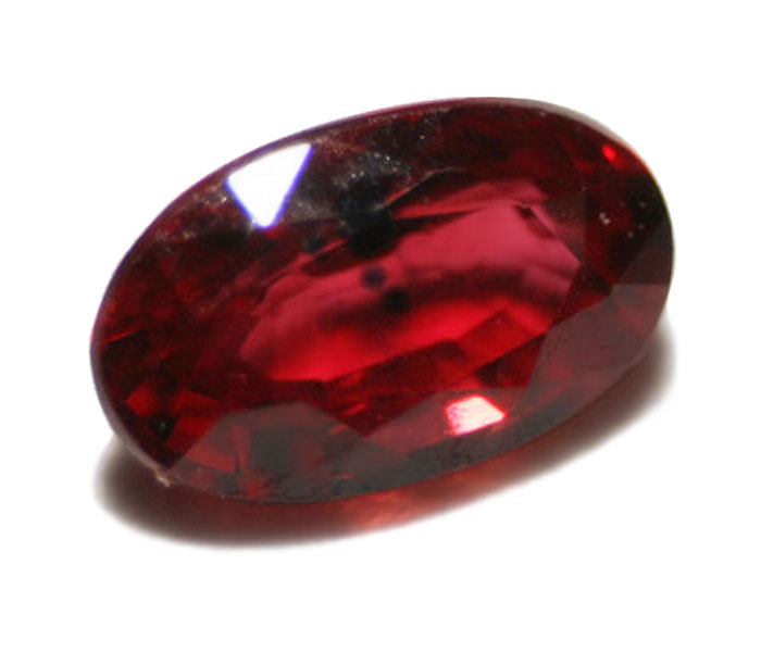 Cut ruby gemstone with inclusions