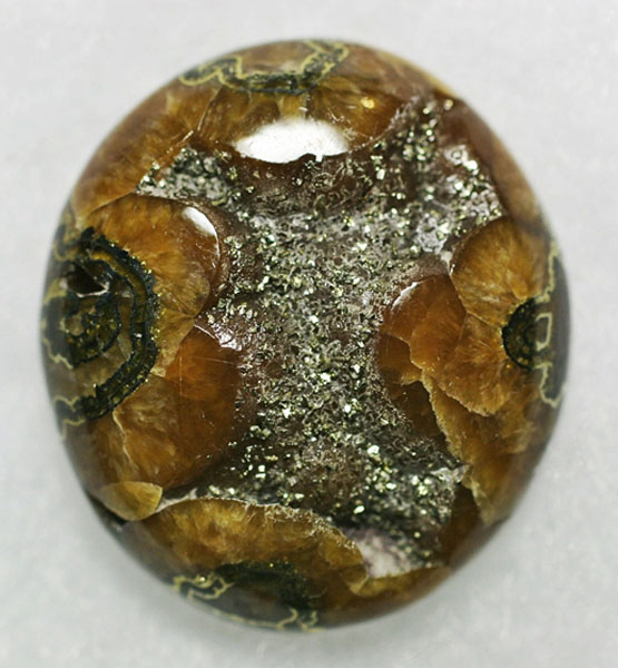 Simbircite cabochon with pyrite druzy