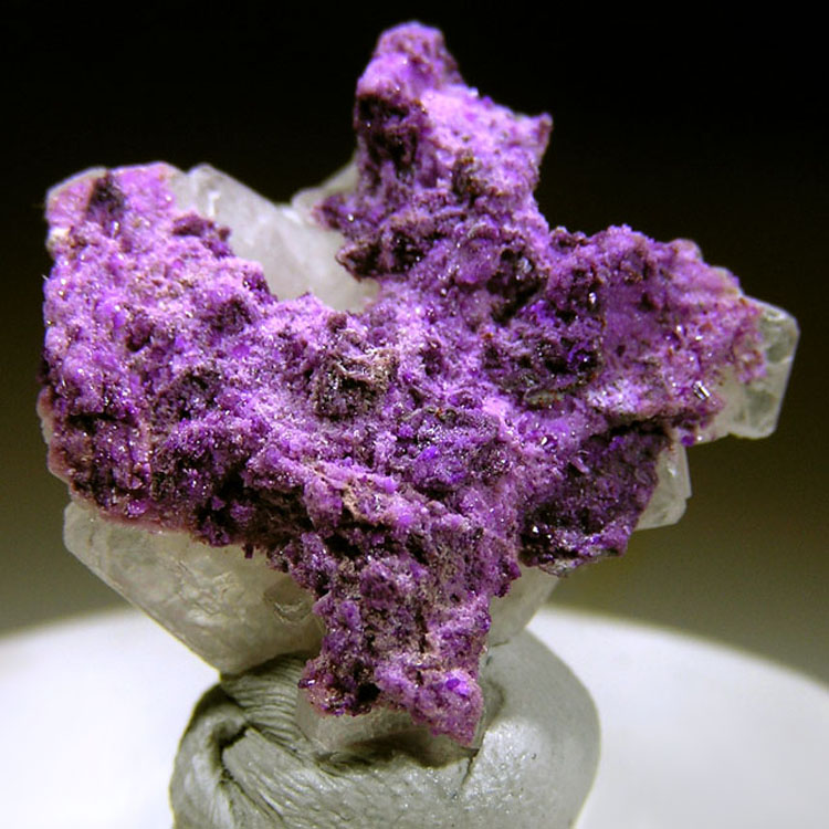 Sugilite on a matrix of barite crystals