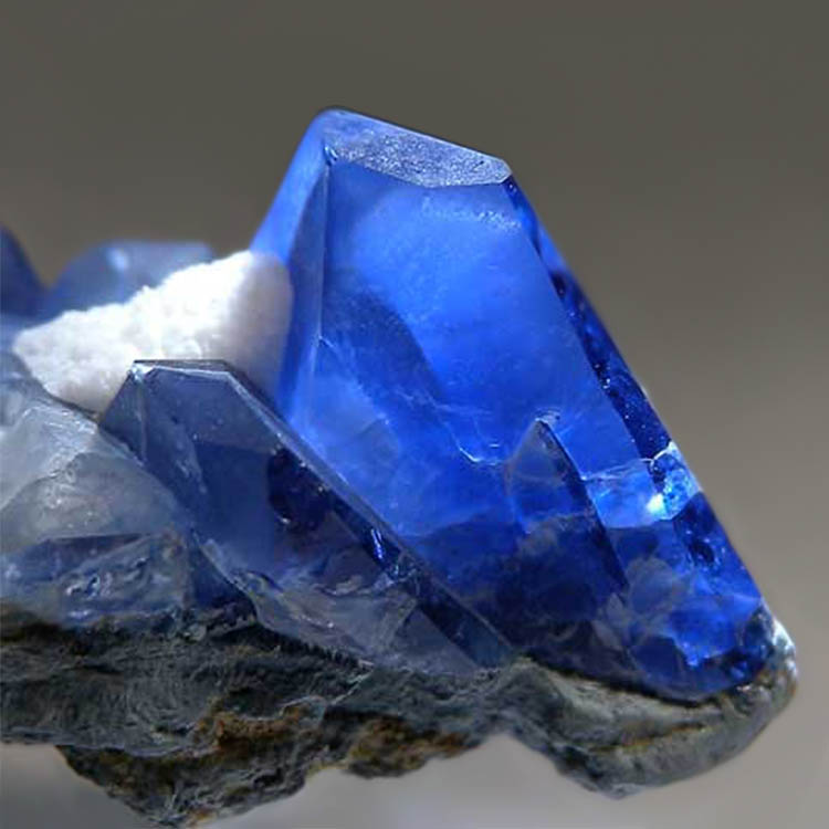 Deep blue benitoite crystals on matrix